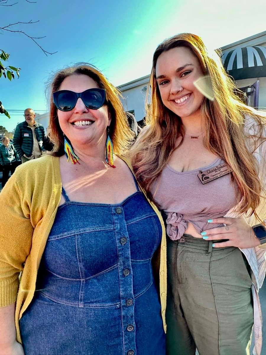 Two smiling guests at the June 2023 First Thursday Mixer hosted by Holly Yashi