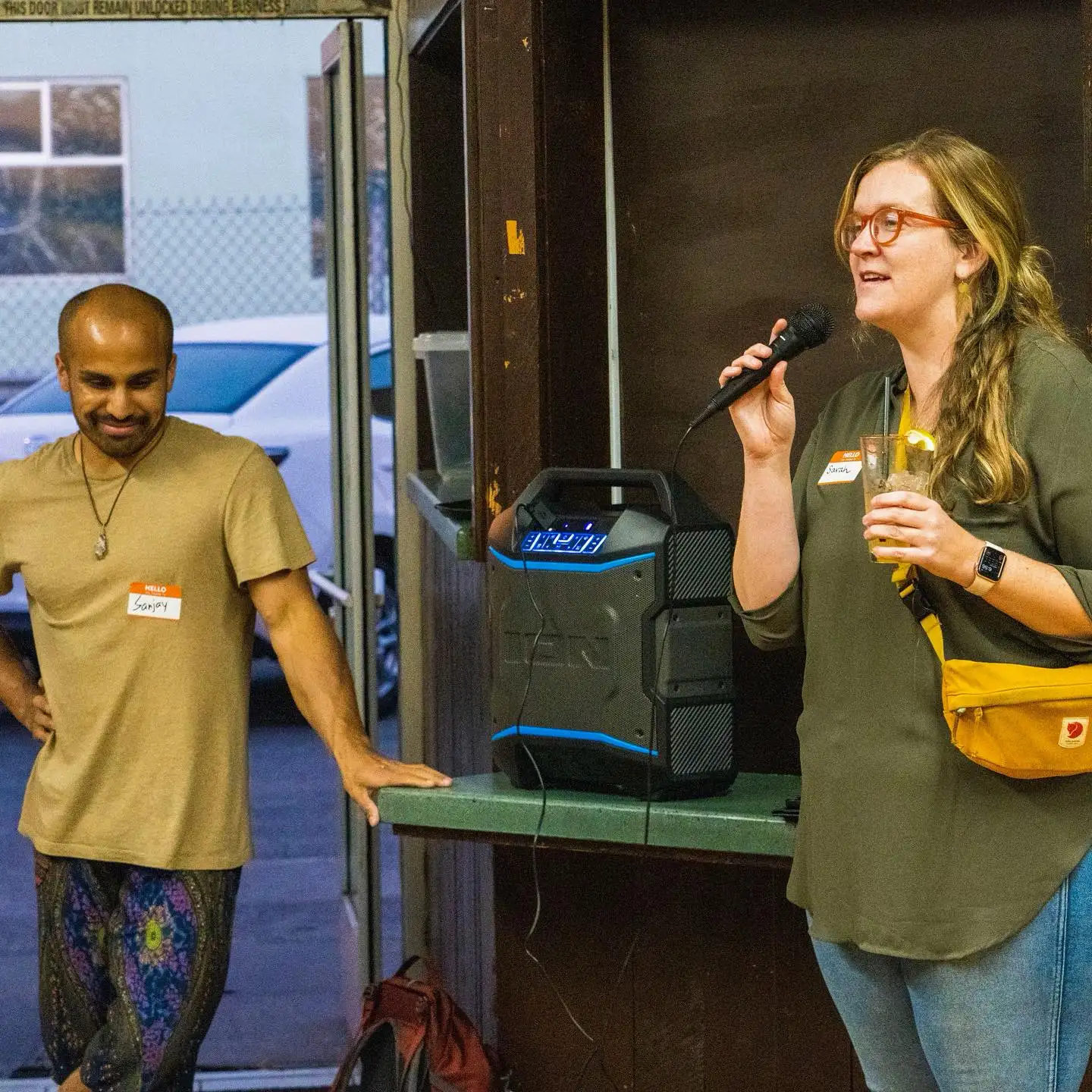A woman speaks on a microphone at an Arcata Chamber of Commerce Young Professionals Network event